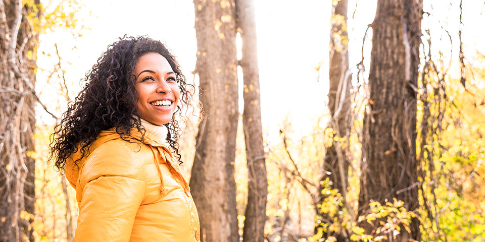 Young woman in autumn woods