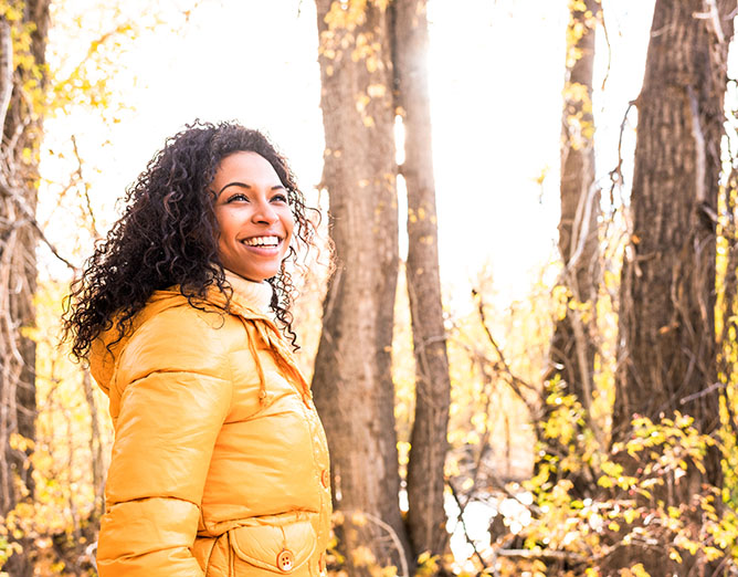 Young woman in autumn woods