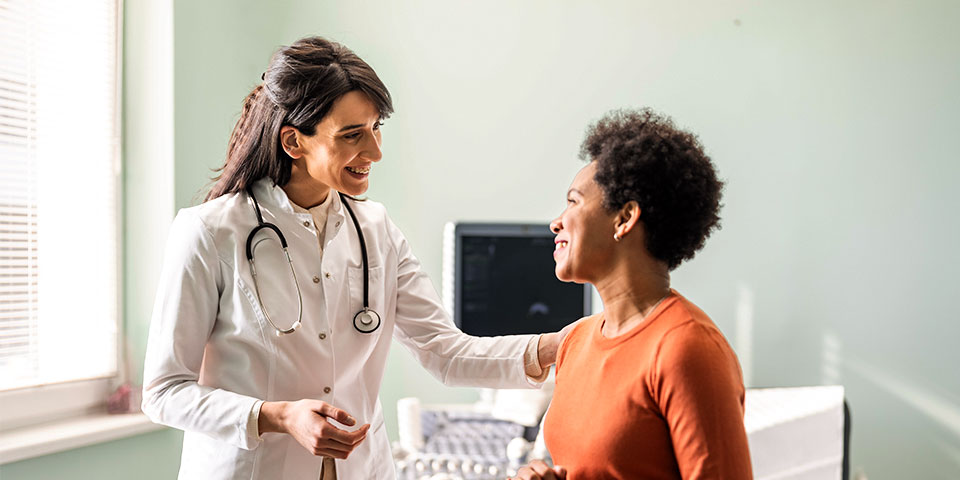 Healthcare provider meeting with patient in a clinic setting