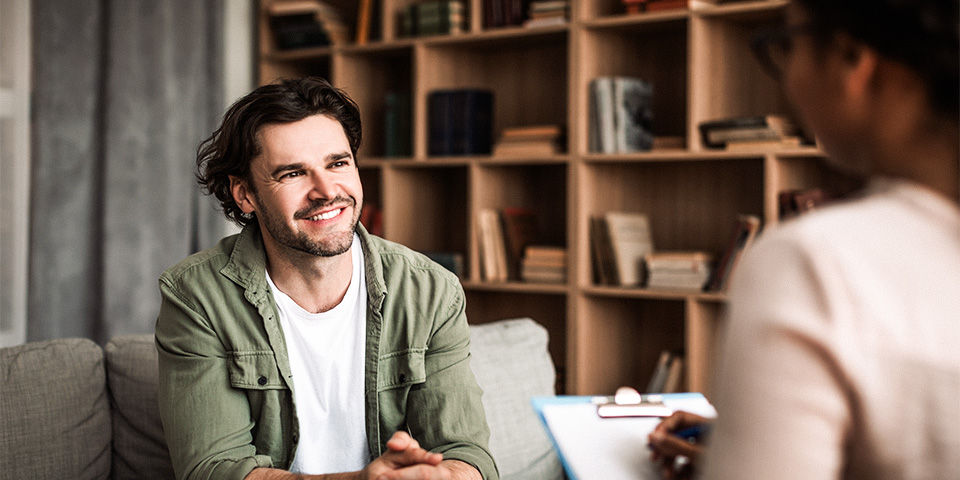 Two males in conversation in an office setting