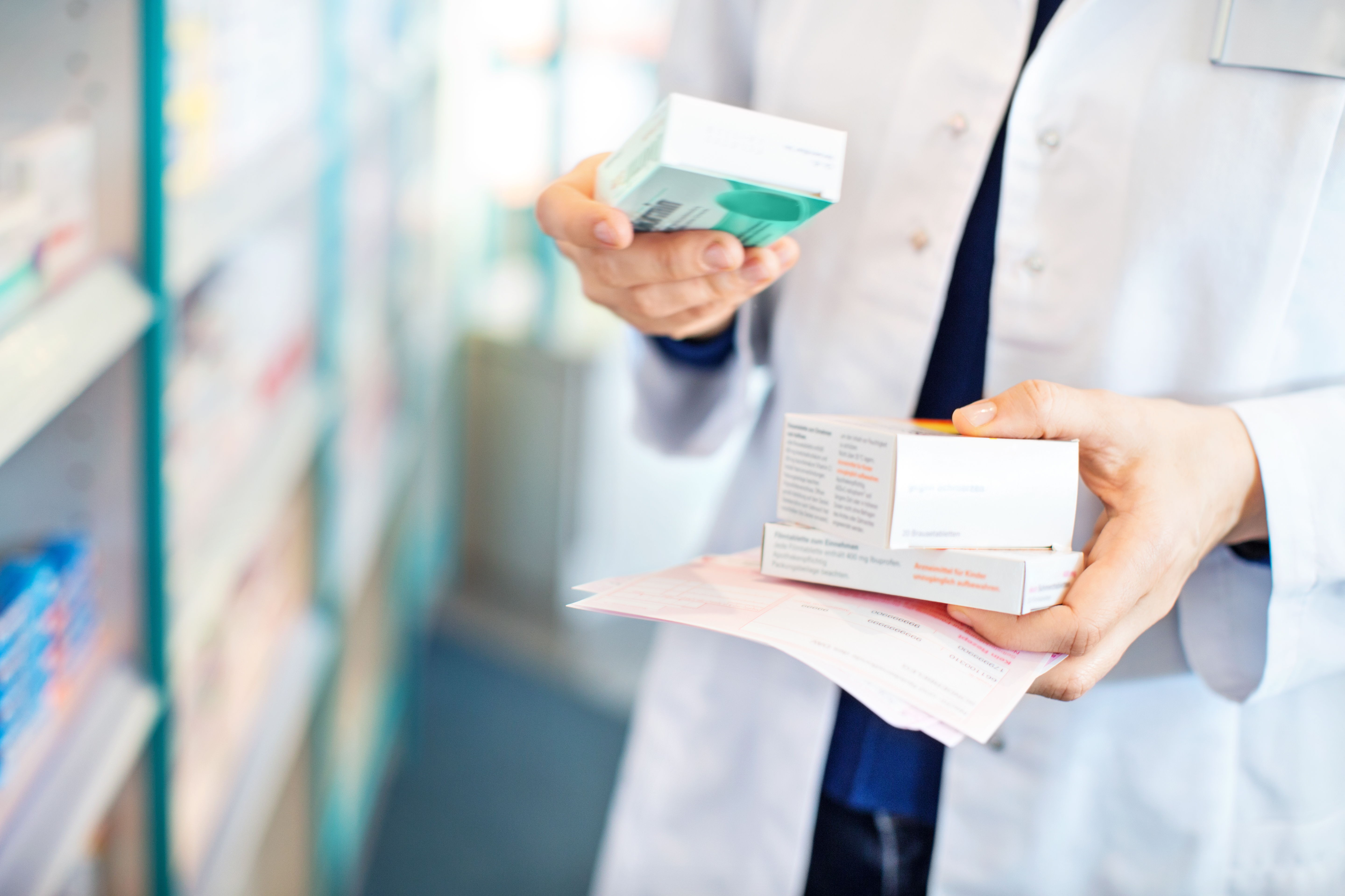 Closeup of pharmacist Pharmacy technician viewing medication